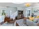 Elegant living room with wood floors, a staircase, and an open floor plan at 861 Nectar Rd, Venice, FL 34293