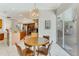 Dining area with access to the kitchen and backyard pool area at 8712 Grey Oaks Ave, Sarasota, FL 34238