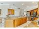 Kitchen with stainless appliances, granite counters and wood cabinets at 8712 Grey Oaks Ave, Sarasota, FL 34238
