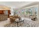 Open living space with kitchen access, comfortable seating and bright natural light at 8712 Grey Oaks Ave, Sarasota, FL 34238