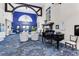 Grand lobby featuring a piano, elegant seating, and high ceilings for a welcoming, sophisticated ambiance at 8712 Grey Oaks Ave, Sarasota, FL 34238