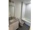 Modern bathroom featuring subway tile, a granite-topped vanity, and modern fixtures at 8810 1/2 N Mulberry St, Tampa, FL 33604
