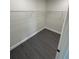 Walk-in closet featuring dark floors and wire shelving at 8810 N Mulberry St, Tampa, FL 33604