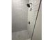 Bathroom featuring a shower tiled with subway tile and a mosaic tile floor at 8810 N Mulberry St, Tampa, FL 33604