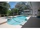 Screened-in backyard pool and hot tub area with clear water, patio space, and lush greenery at 11274 Beebalm Cir, Lakewood Ranch, FL 34202