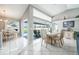 Eat-in dining area with tile flooring and sliding glass doors to the pool at 11895 Claremont Dr, Port Charlotte, FL 33981