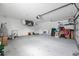 Spacious two car garage with lots of storage space and overhead lighting at 11895 Claremont Dr, Port Charlotte, FL 33981
