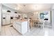 Open-concept kitchen with breakfast bar and adjacent dining area at 11895 Claremont Dr, Port Charlotte, FL 33981