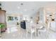 Bright, open-concept living and dining area with tile floors and large windows at 11895 Claremont Dr, Port Charlotte, FL 33981