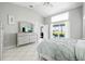 Bright main bedroom with sliding glass doors to the lanai and pool area at 11895 Claremont Dr, Port Charlotte, FL 33981