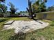 Large backyard featuring a concrete slab and mature trees at 1317 Venetia St, Nokomis, FL 34275
