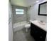 Updated bathroom features tiled shower, modern vanity, and updated fixtures at 1317 Venetia St, Nokomis, FL 34275