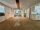 Inviting living area featuring hardwood floors, ample natural light, and an open layout at 1317 Venetia St, Nokomis, FL 34275