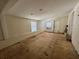 This living room features an exit door and subfloor, ready for upgrades at 1317 Venetia St, Nokomis, FL 34275
