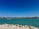Scenic waterfront view featuring a sailboat on a beautiful clear day at 1317 Venetia St, Nokomis, FL 34275