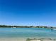 Beautiful waterfront view of tropical houses and boats, perfect for enjoying coastal living at 1317 Venetia St, Nokomis, FL 34275