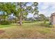 Expansive backyard with lush greenery and serene water views, perfect for outdoor enjoyment and relaxation at 1363 New Forest Ln, Osprey, FL 34229