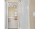 Bathroom entrance featuring tile floors, double doors and access to a tub at 1363 New Forest Ln, Osprey, FL 34229