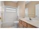 Cozy bathroom featuring a tub and shower combination and a light wood vanity at 1363 New Forest Ln, Osprey, FL 34229