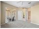 Bright carpeted bedroom with a sliding glass door to the lanai and an adjacent bathroom for added convenience at 1363 New Forest Ln, Osprey, FL 34229