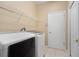 Convenient laundry room equipped with a washer, dryer, and overhead shelving at 1363 New Forest Ln, Osprey, FL 34229