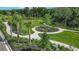 Scenic community park with walking paths, lush greenery, and landscaping for outdoor activities at 16202 Isola Pl, Bradenton, FL 34211
