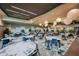 This bright dining room offers modern decor, lovely light fixtures, and seating for large gatherings at 16202 Isola Pl, Bradenton, FL 34211