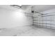A clean garage with concrete flooring, ample space, and an automatic door for convenient access at 16202 Isola Pl, Bradenton, FL 34211