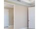 Bright hallway with white trim and doors, offering seamless flow and a clean aesthetic at 16202 Isola Pl, Bradenton, FL 34211