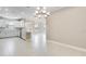 Spacious kitchen with white cabinets, stainless steel appliances, and a stylish chandelier at 16202 Isola Pl, Bradenton, FL 34211