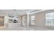 Open concept living area featuring tile floors, recessed lighting, and a kitchen bar at 16202 Isola Pl, Bradenton, FL 34211