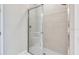 Modern shower with glass door and white subway tile provides a clean, spa-like experience at 16202 Isola Pl, Bradenton, FL 34211