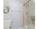 Bathroom featuring a toilet, mermaid wall hanging, and a glass-enclosed shower at 175 Kings Hwy # 428 B8, Punta Gorda, FL 33983