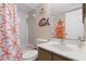Bathroom featuring starfish-themed decor, a shower, and a single sink vanity at 175 Kings Hwy # 428 B8, Punta Gorda, FL 33983