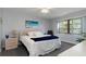 A bright bedroom featuring a serene aesthetic and an exterior view at 175 Kings Hwy # 428 B8, Punta Gorda, FL 33983