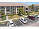 Attractive building exterior, with well-maintained landscaping, sidewalks, and parking at 175 Kings Hwy # 428 B8, Punta Gorda, FL 33983
