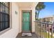 Condo entrance with a welcome mat, window, and balcony railing at 175 Kings Hwy # 428 B8, Punta Gorda, FL 33983