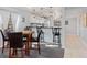Kitchen with breakfast bar looks to open-concept dining/living area at 175 Kings Hwy # 428 B8, Punta Gorda, FL 33983
