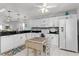 Bright kitchen featuring white cabinets and modern appliances at 175 Kings Hwy # 428 B8, Punta Gorda, FL 33983