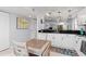 Bright kitchen with white cabinets, stainless steel appliances, and adjacent living room at 175 Kings Hwy # 428 B8, Punta Gorda, FL 33983