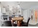 The open kitchen features modern lighting, and a dining table with seating for four at 175 Kings Hwy # 428 B8, Punta Gorda, FL 33983