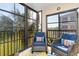 Relaxing lanai with comfortable wicker seating and scenic views at 175 Kings Hwy # 428 B8, Punta Gorda, FL 33983