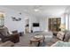 A comfy living room featuring sliders to a private outdoor sitting area at 175 Kings Hwy # 428 B8, Punta Gorda, FL 33983
