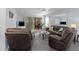 The living room includes a sofa, recliner, sliders, and plush carpeting at 175 Kings Hwy # 428 B8, Punta Gorda, FL 33983