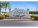 Newport Condominiums & St. James Place sign with colorful landscaping at 175 Kings Hwy # 428 B8, Punta Gorda, FL 33983