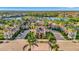 Stunning aerial view of the community with a beautiful clubhouse and pool area at 20228 Lagente Cir, Venice, FL 34293