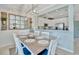 Bright dining area with seating for six and decorative furnishings next to the kitchen at 20228 Lagente Cir, Venice, FL 34293