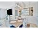 Dining area with a decorative mirror, table for six, and a hanging light fixture at 20228 Lagente Cir, Venice, FL 34293