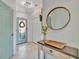 Welcoming foyer featuring a neutral color palette, decorative wreath, and a modern accent table at 20228 Lagente Cir, Venice, FL 34293
