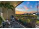 Relaxing screened patio overlooking manicured yard and beautiful sunset views at 20228 Lagente Cir, Venice, FL 34293